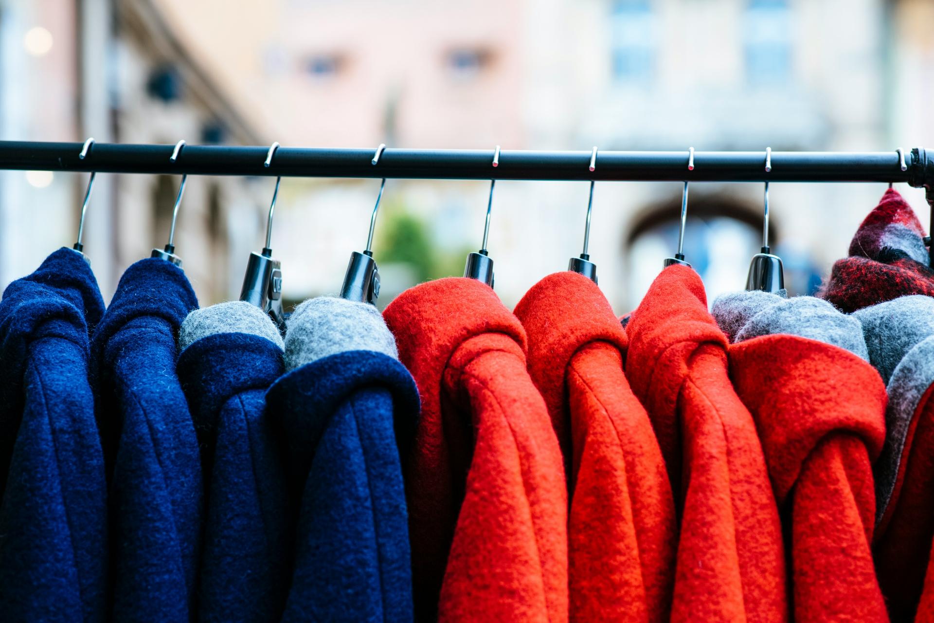 image of winter coats on a coat rack.